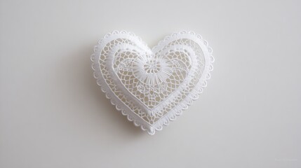 White lace heart doily on white