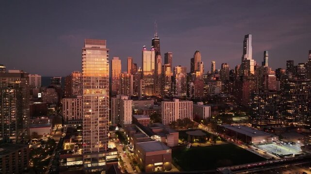 Aerial Sunset View of Downtown Chicago Skyline from the West Loop This aerial shot appears to be taken from the West Loop / Fulton Market area of Chicago, looking east toward the downtown skyline. You
