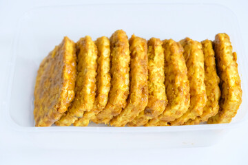 Tempeh yellow spices in plastic containers for stock in refrigerator