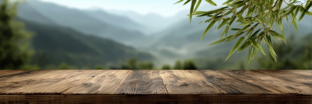 Empty Bamboo Table Top Framed by Leaves in a Serene Rainforest Valley With Misty Mountains