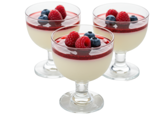 three glossy panna cotta italian desserts in elegant stemmed cups with ruby-red berry coulis and fresh fruit, isolated on a transparent studio background with extreme bokeh. concept for luxury food