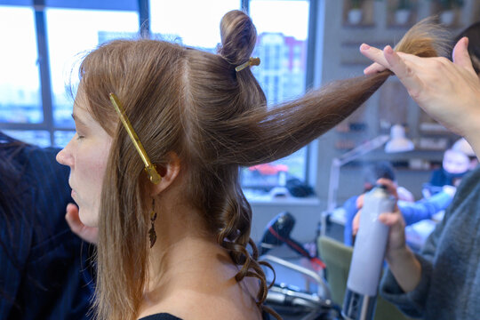 Beauty transformation in a vibrant salon with expert hairstyling techniques