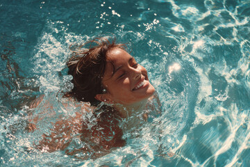 Joyful woman splashing in sunlit water