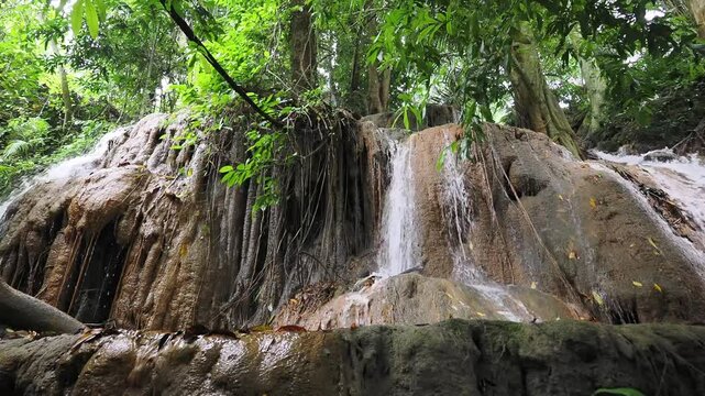 Waterfall made from sedimentary limestone that has accumulated in layers