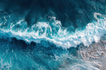 Ocean waves crashing on sandy beach, conveying sense of power and tranquility