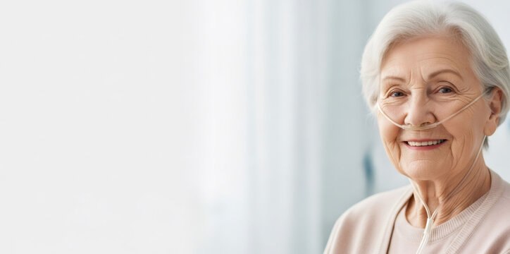 Senior woman with a nasal cannula providing oxygen therapy, exemplifying healthy aging and medical care recovery. Banner with copy space
