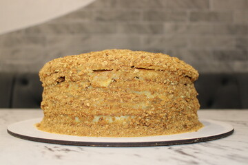 Delicious layered cake with a crunchy topping prepared for a special celebration at a cozy bakery setting