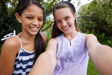 Happy girl, portrait and teenager with selfie for photography bonding or outdoor fun together. Children, youth or friends with smile for picture, capture moment or social media in backyard garden