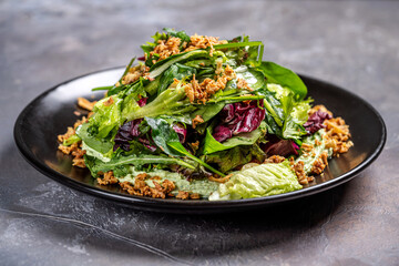Fresh mixed green salad with crispy toppings