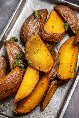 Crispy roasted potato wedges with herbs
