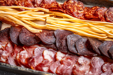 Assorted smoked meats and cheese sticks platter