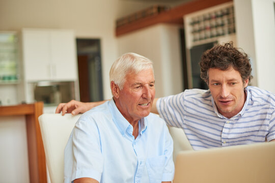 Laptop, teaching and senior dad with man in home for social media, visit or bonding. Support, family and learning with elderly father for adult son, tech and help for internet safety for retirement
