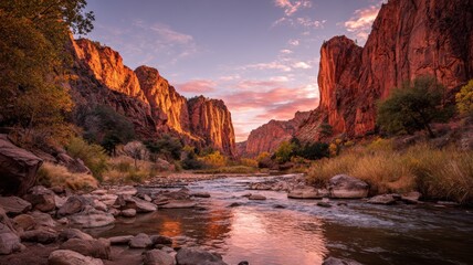 Sunset over red cliffs and winding river in a scenic park with warm golden light and vibrant pink sky illuminating the landscape