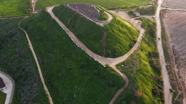 A cinematic view of Hod HaSharon&rsquo;s diverse landscapes, featuring the city&rsquo;s ecological park, surrounding fields, and urban scenery. The footage highlights a peaceful lake, natural greenery, open agric