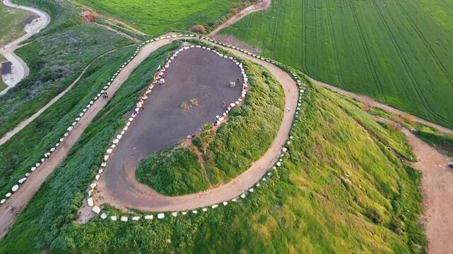 A cinematic view of Hod HaSharon&rsquo;s diverse landscapes, featuring the city&rsquo;s ecological park, surrounding fields, and urban scenery. The footage highlights a peaceful lake, natural greenery, open agric