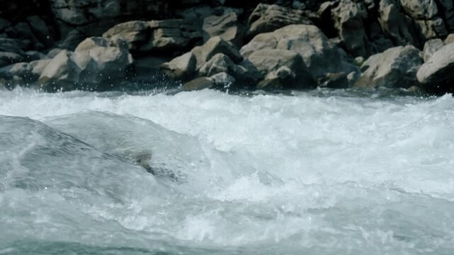 The turbulent waves are breathtaking, characterized by dynamic patterns and foam bubbles in rivers or oceans that truly showcase incredible energy and unparalleled beauty