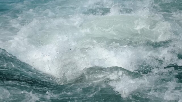 The turbulent waves are breathtaking, characterized by dynamic patterns and foam bubbles in rivers or oceans that truly showcase incredible energy and unparalleled beauty