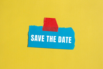 Save the date message written on ripped torn paper background. Conceptual Save the date symbol. Copy space.