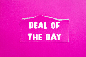 Deal of the Day message written on ripped torn paper background. Conceptual Deal of the Day symbol. Copy space.
