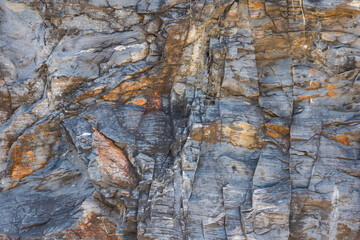 The rock layer broke in the cliff.