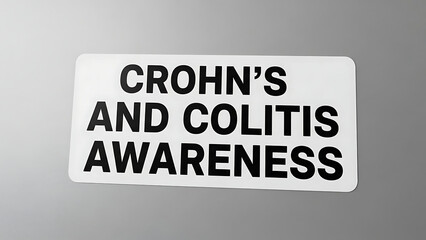 A close up of a white sign with text about crohn's and colitis awareness month 4K and HD image