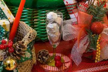 Fototapeta premium Merry Christmas composition. New year, Christmas gifts, red basket, fir branches, gift packages, decorations. 