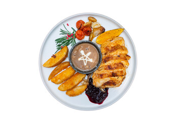 A delicious grilled chicken dish artfully arranged on a plate with various sides
