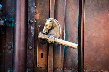 Fototapeta premium Door handles in the shape of a horse's head at the entrance of the National and University Library of Slovenia, designed by Joze Plecnik on Turjaska Street, Ljubljana, Slovenia