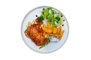 Delicious chicken meal with sides of fries and fresh salad on a plate