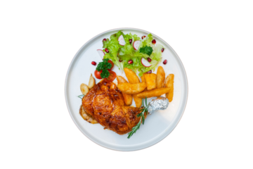 A delicious roast chicken leg with sides served on a plate. The plate contains crispy fries, fresh salad and other vegetables