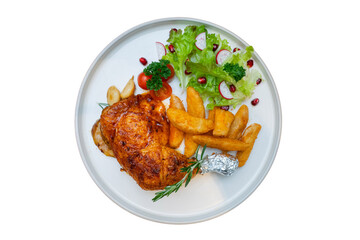 A delicious roasted chicken dish with sides of fries and salad, ready to eat
