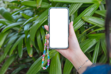 Woman or girl holding phone blank outdoor on a white wall. Phone mockup