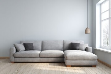 Fototapeta premium Comfortable sectional sofa in a bright room with large window and wooden floor.
