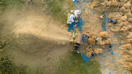 Traditional Rice Threshing in Bangladesh – Aerial View of Farmers Working with Threshing Machine