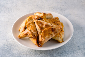 Homemade triangular pastry with spinach and cheese. A traditional Middle Eastern dish.