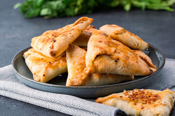 Homemade triangular pastry with spinach and cheese. A traditional Middle Eastern dish.