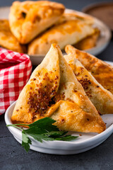 Homemade triangular pastry with spinach and cheese. A traditional Middle Eastern dish.