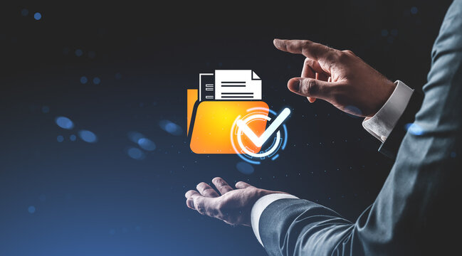 Businessman interacting with digital folder and checkmark icon representing data approval concept on futuristic background in a creative style. - Powered by Adobe