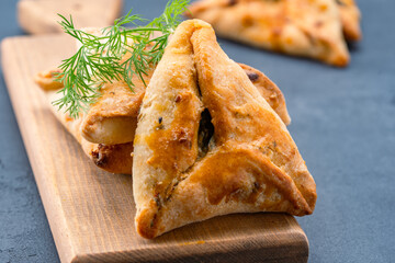 Homemade triangular pastry with spinach and cheese. A traditional Middle Eastern dish.