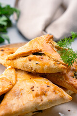 Homemade triangular pastry with spinach and cheese. A traditional Middle Eastern dish.
