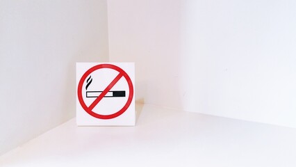 No Smoking Sign in Bright White Corner