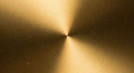 Brushed gold metallic surface with radial texture and subtle scratches for elegant background