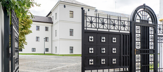 Two floors semi detached white country houses with front garden and white fence