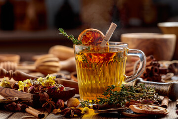Herbal tea with thyme and dried orange slice.