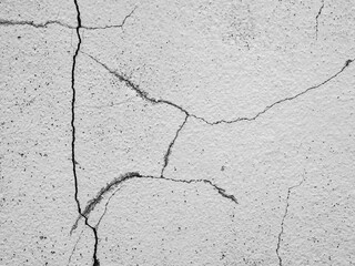 Crack wall texture background broken earthquake effect, whtie grey building cement damage pattern plaster grunge black line paint surface abstract, construction rough street concrete backdrop.