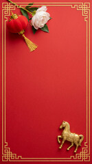Flatlay Red Chinese lantern, golden horse, white flower, festive decor