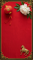 Flatlay Red Chinese lantern, golden horse, white flower, festive decor