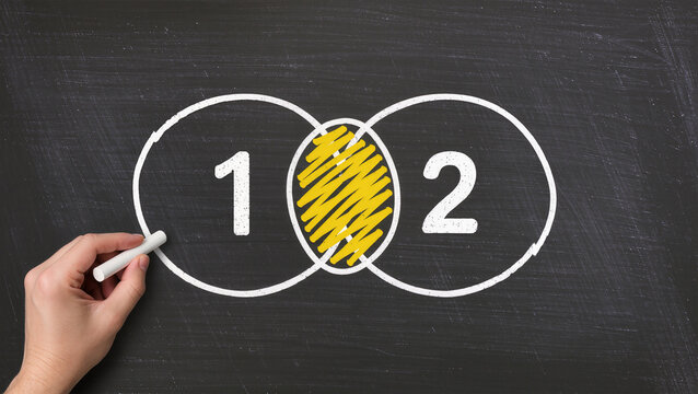 Venn diagram on blackboard, Business man drawing two circles