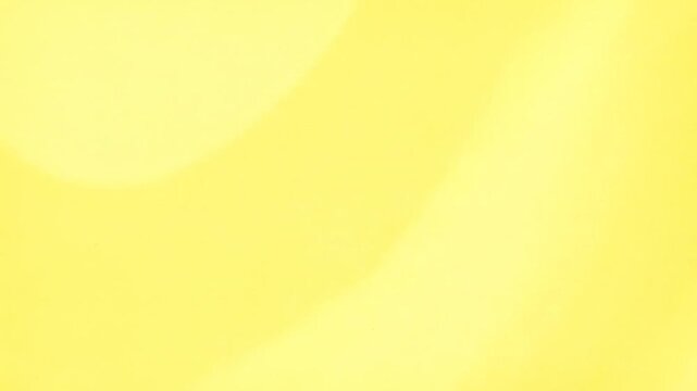 Soft, flowing, abstract yellow gradient with gentle curves and subtle textures. The background is a warm hue