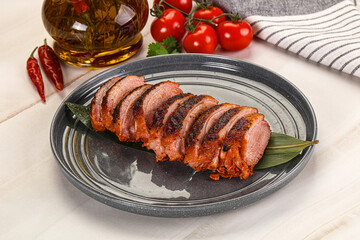 Sliced duck breast baked with cherry